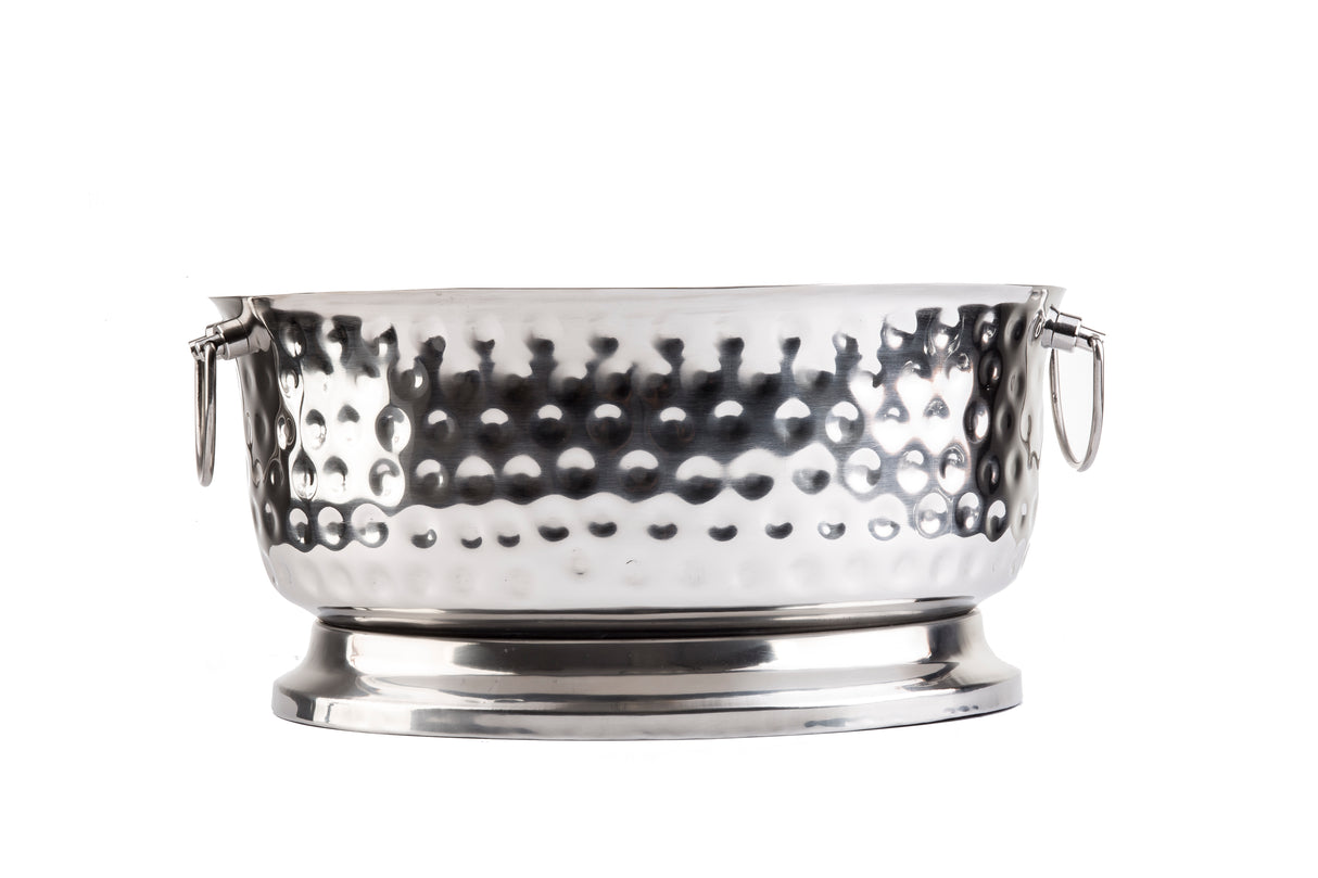 A large, round stainless steel beverage tub with a hammered texture, two side handles, and a raised base, shown against a plain white background. Part of the Bali Collection Beverage Tub series.