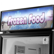 A Turbo Air TGF-23F(B)-N Sign Panel displays “Frozen Food” in large, pink-outlined letters on a blue background with ice and snowflake graphics, while images of ice cream cones and sundaes decorate both sides above the freezer door.