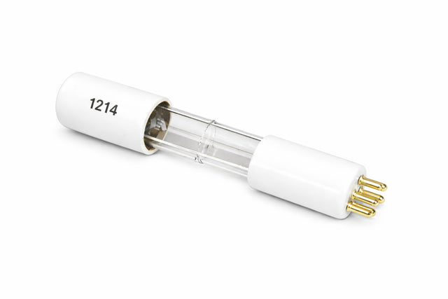 A clear glass UV replacement bulb with white ceramic end caps, each featuring three gold pins. The left end cap is labeled 1214 in black text. Ideal for large machines requiring high intensity light, the lamp lies diagonally on a white background.