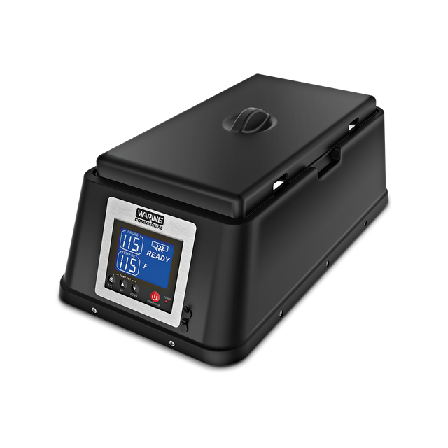 A black rectangular sous vide machine with a digital control panel displaying “115,” “READY,” and other settings in blue LED. This countertop appliance, resembling a chocolate melter, features a closed lid with handle and sits on a white background.