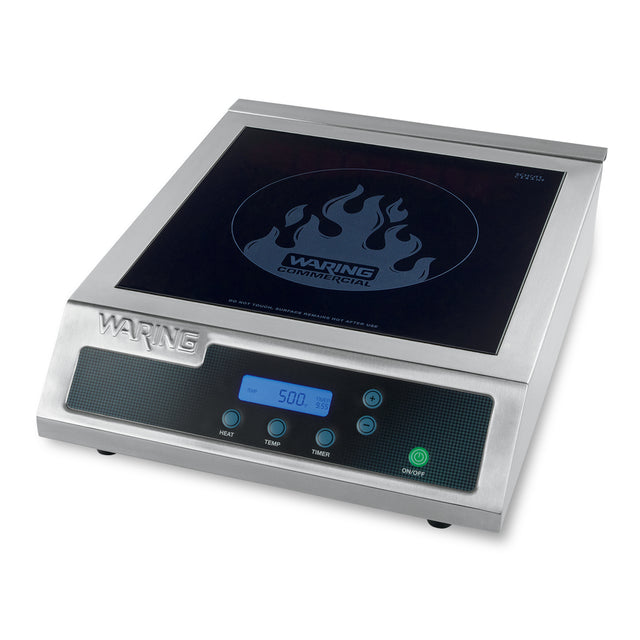 A stainless steel Waring commercial countertop induction range with a digital display showing 500. It features heat, temp, and timer buttons, a power button, and a black single hob cooking surface with a flame graphic and the Waring logo.