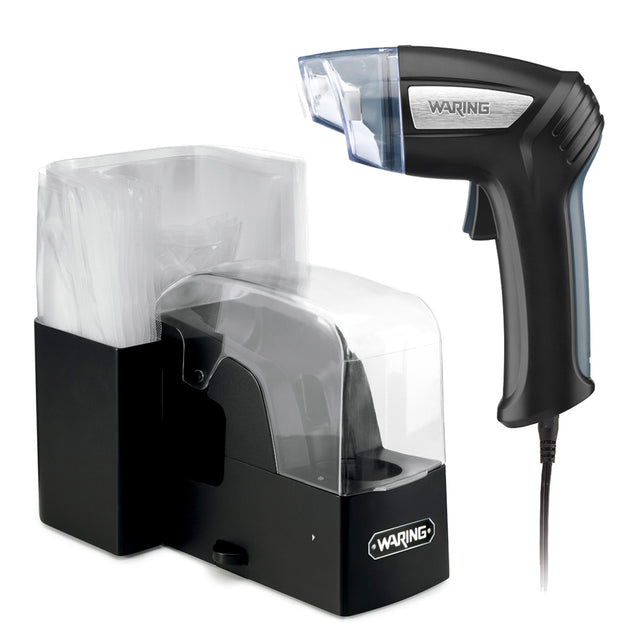 A Waring commercial handheld vacuum sealer with a black and silver trigger-style handle, attached to a power cord, sits beside a black dispenser holding clear vacuum sealer bags—both part of a sleek, modern Vacuum Sealing System.