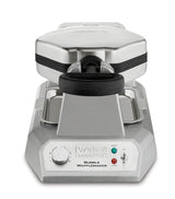 A silver Waring WBW300X Bubble Waffle Maker with a black handle, temperature control dial, and indicator lights for power and readiness on the front panel. This sturdy commercial waffle maker features an angular base and a large, hinged waffle plate on top.