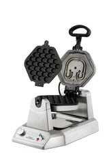 The Waring WBW300XCE Bubble Waffle Maker features a stainless steel, hexagonal, bubble-shaped plate that opens vertically. It’s ideal for international use, with heating coils, drip tray, control knobs, and front indicator lights.