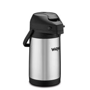 A vacuum insulated airpot with a black plastic lid and handle. The lid features a push lever and spout for dispensing beverages. The brand name “Waring” is printed in black on the front. The stainless steel airpot stands upright on a white background.
