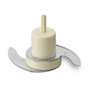 A close-up of a Waring WCG75 Chopping Blade shows two curved, sharp metal blades attached to a cream-colored plastic center hub and shaft, set against a white background. The hub has embossed text and the blades feature fine serrated edges.