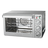 A stainless steel countertop oven with a glass door, two wire racks inside, and three control dials labeled Function, Temp, and Timer. Fits a quarter-size sheet pan and features indicator lights above the dials. Brand name Waring on the front.
