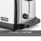 Close-up of a stainless steel Waring Commercial Toaster with extra long slots. A black dial (1–6) adjusts toasting levels, and three black buttons—Cancel, Bagel, Defrost—are on the right. Text: “CONTROL TOASTING… with an Easy-to-Grasp Rotary Dial.”.