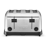A stainless steel 4 slice toaster with extra wide slots, two levers, and browning control dials. The Waring brand name is engraved on the sleek design with a black base, perfect for modern kitchens. Shown against a white background.