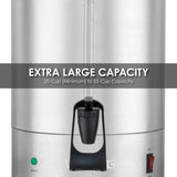A close-up of a stainless steel Coffee Urn with a black spigot in the center. Text reads, “EXTRA LARGE CAPACITY 25-Cup (Minimum) to 55-Cup Capacity.” Featuring dual heater system and green and red lights at the bottom right.