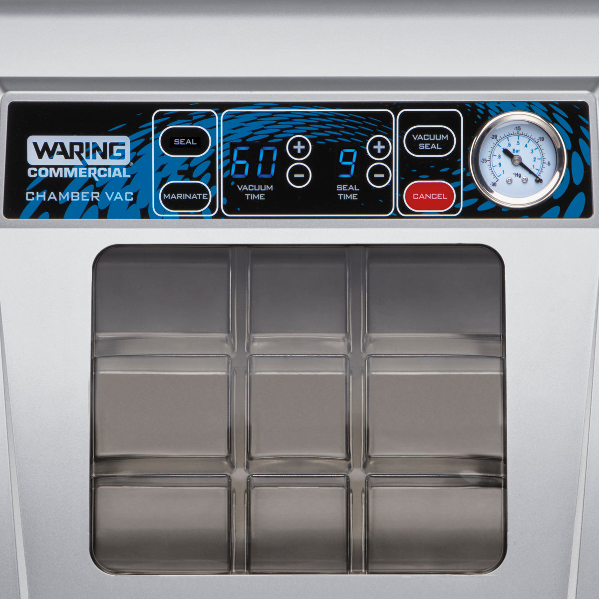 Close-up of a Waring Vacuum Packaging Machine control panel. Display shows “60” for vacuum time and “9” for seal time. Countertop unit features Seal, Marinate, Vacuum Seal, and Cancel buttons, a pressure gauge, and part of the chamber lid below.