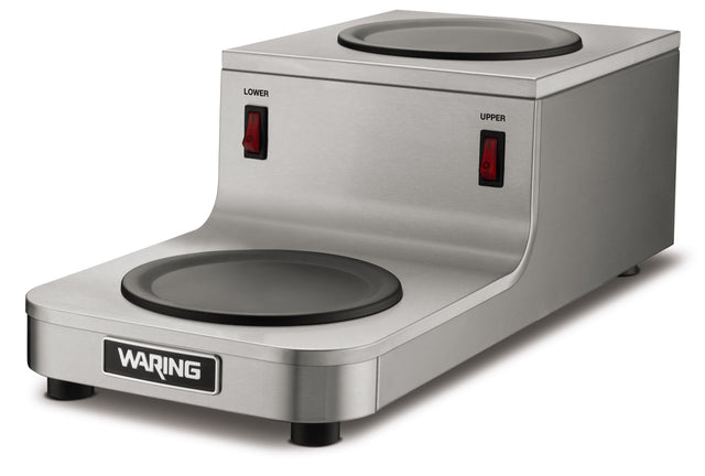 The Café Deco Coffee Warmer features a stainless steel build, two black heating plates in a double burner design, red power switches for upper and lower control, and four sturdy feet. Its compact style fits any space with one plate on top and one in front.