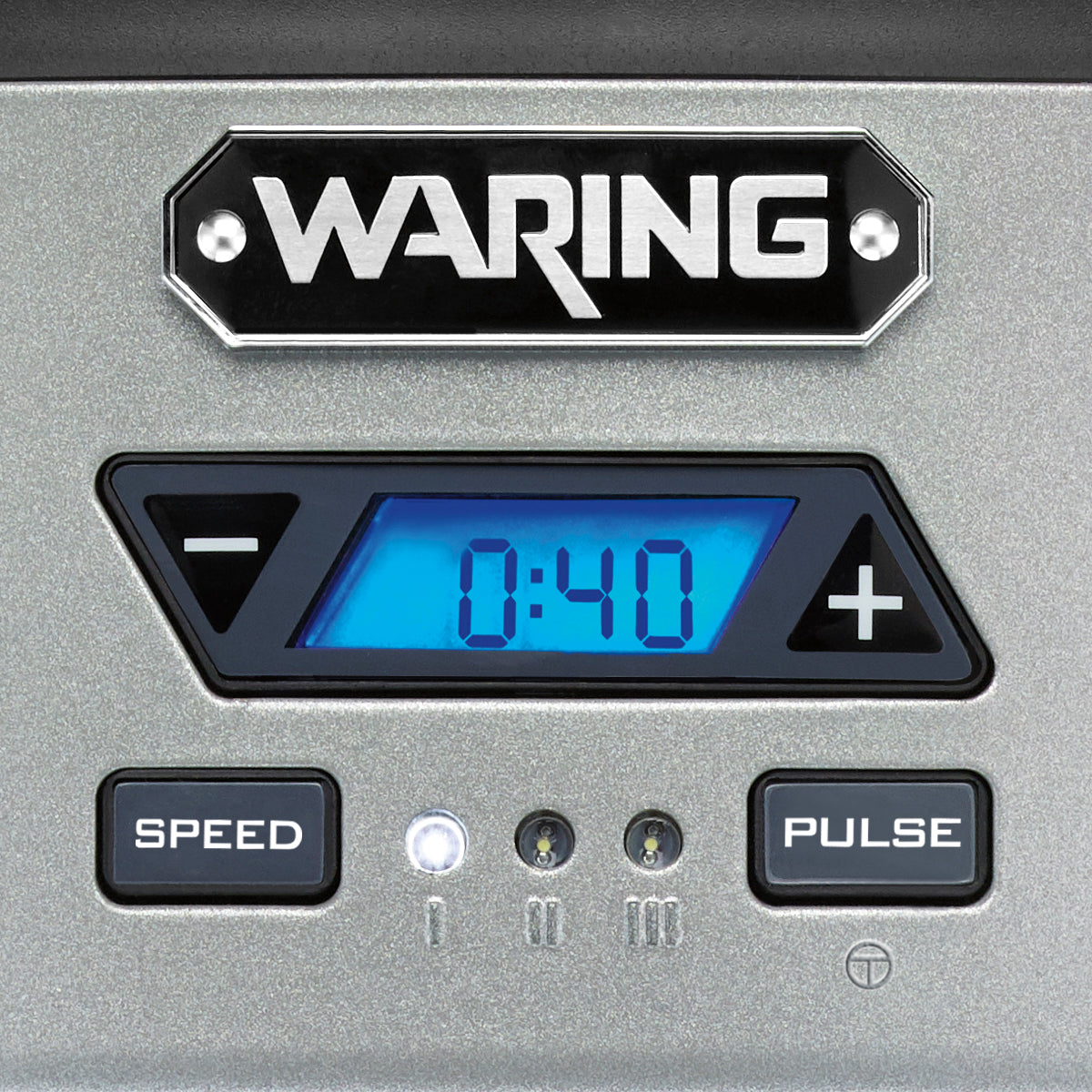 A digital control panel on the Waring WDM120TX Single Spindle Drink Mixer displays 0:40 in blue. It features left and right arrow buttons, SPEED and PULSE buttons below, and three indicator lights with increasing line symbols on a metallic gray background.