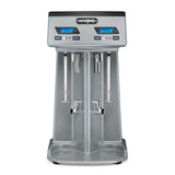 A silver Waring countertop drink mixer with a double spindle, digital display screens, and control buttons. This modern, industrial machine features dual mixing stations for easily preparing beverages like milkshakes or smoothies.