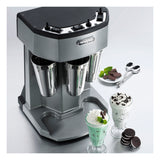 A silver triple spindle Drink Mixer with three metal cups sits on the counter. In front are two milkshakes—one mint chocolate and one cookies-and-cream—topped with whipped cream, surrounded by cookies, mint, and spoons.