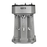 A silver, triple spindle commercial drink mixer with a rectangular body, Waring logo on front, three mixing rods with removable cups, and a sturdy base. The fully automatic appliance is designed for mixing beverages and stands on a white background.