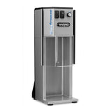 A silver Waring Big Freeze commercial frozen beverage machine with a Solid Agitator, dial, switches, and a dispensing area beneath a clear shield. The upright rectangular unit features Waring branding and controls on the front panel.