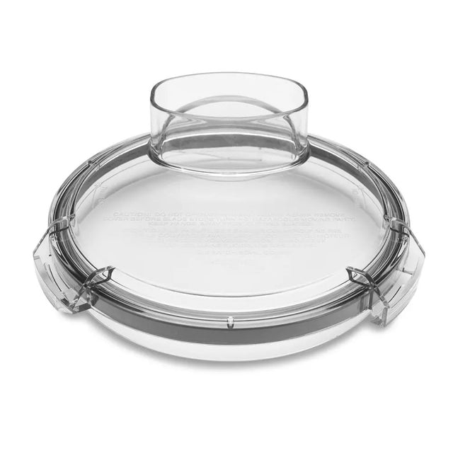 A clear, round plastic lid with a central, oval-shaped opening, designed for the LiquiLock Batch Bowl. This WFP11S flat cover features a raised rim and three latch-like clasps evenly spaced along the edge for a secure fit.