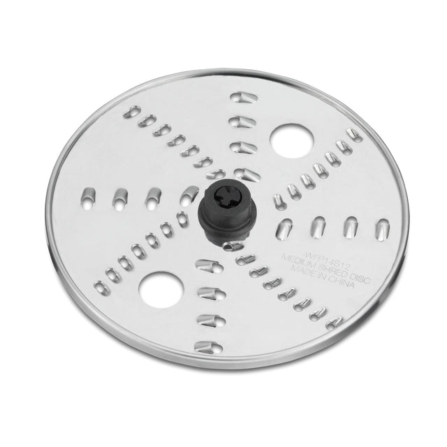 A round, silver reversible shredding disc for the WFP14S food processor, featuring sharp slits, a central black plastic attachment hub, and engraved text. Its reflective surface is photographed on a plain white background.
