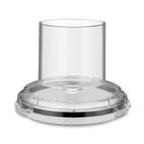 A clear, round Waring food processor lid with a wide, vertical feed chute at the center. The LiquiLock Batch Bowl Cover WFP14S3 features a secure rim and smooth, transparent surface, designed to fit snugly onto the base.