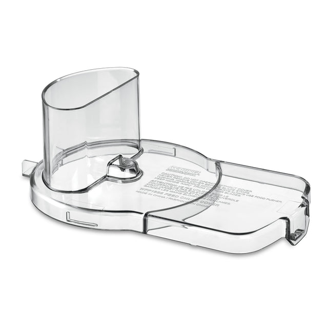 A transparent, curved Waring food processor chute and lid part with printed safety instructions, featuring a cylindrical feed tube, locking mechanism, and hinged section. This Continuous Feed Chute (WFP16SCD) allows safe ingredient addition.