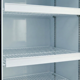 A close-up of an empty commercial refrigerator, model EGM-13W, with three white wire shelves and a clean, glossy interior. The shelves are evenly spaced, and the fridge door is open—perfect for displaying Empura Parts or a price tag set.