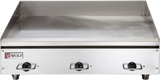 A stainless steel commercial electric griddle with a smooth flat cooking surface, three control knobs at the front, and a raised back and side splash guard. The Wolf brand logo is visible on the front left corner of this countertop cooking appliance.
