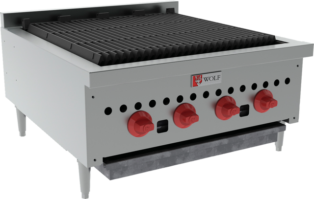The Wolf SCB25_NAT Charbroiler is a commercial countertop charbroiler with four red control knobs, a spacious black grill surface, durable metal legs, and a stainless steel body. The front panel displays the Wolf logo and includes a drip tray below.