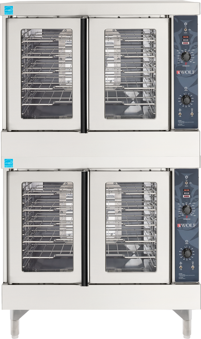 A double-stacked Wolf WC44GD convection oven with four glass doors—two per oven. Each stainless steel unit features multiple metal racks and a control panel with dials, buttons, and the Wolf logo, ideal for any commercial kitchen equipment lineup.