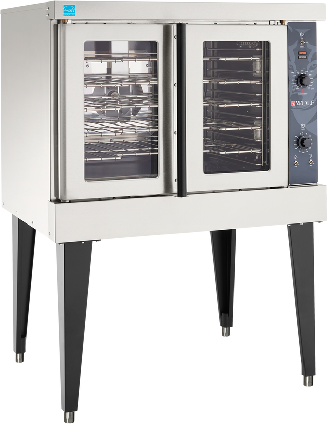 A Wolf WC4ED convection oven on black legs, featuring two clear glass doors. The right side has control knobs and an analog dial with the Wolf logo. The energy-efficient oven interior has multiple racks and a fan for air circulation.