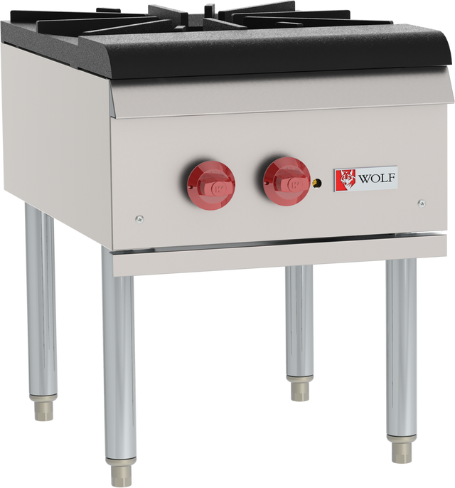A commercial stock pot range with a stainless steel exterior, featuring two burners each controlled by a large red knob. This gas kitchen appliance stands on four metal legs and displays the “Wolf” logo beneath the control panel.