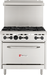 A stainless steel Wolf WX36-6BP restaurant range features six black burner knobs, six burners on top, a large oven below with a handle, and the Wolf brand logo with a red wolf head centered on the oven door—perfect for any commercial kitchen.