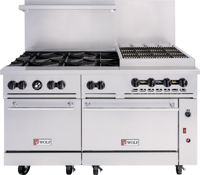 A large, stainless steel cooking unit, this 60-inch gas range features four burners on the left, a grill grate on the right, control knobs, two oven doors below, Wolf brand logos on the front, locking wheels, and a raised backsplash.
