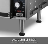 Close-up of a stainless steel countertop pizza oven with a control knob showing temperature settings. The appliance has metal legs with black adjustable feet. Text below reads: ADJUSTABLE LEGS to Set Height to Proper Level for Your Space.