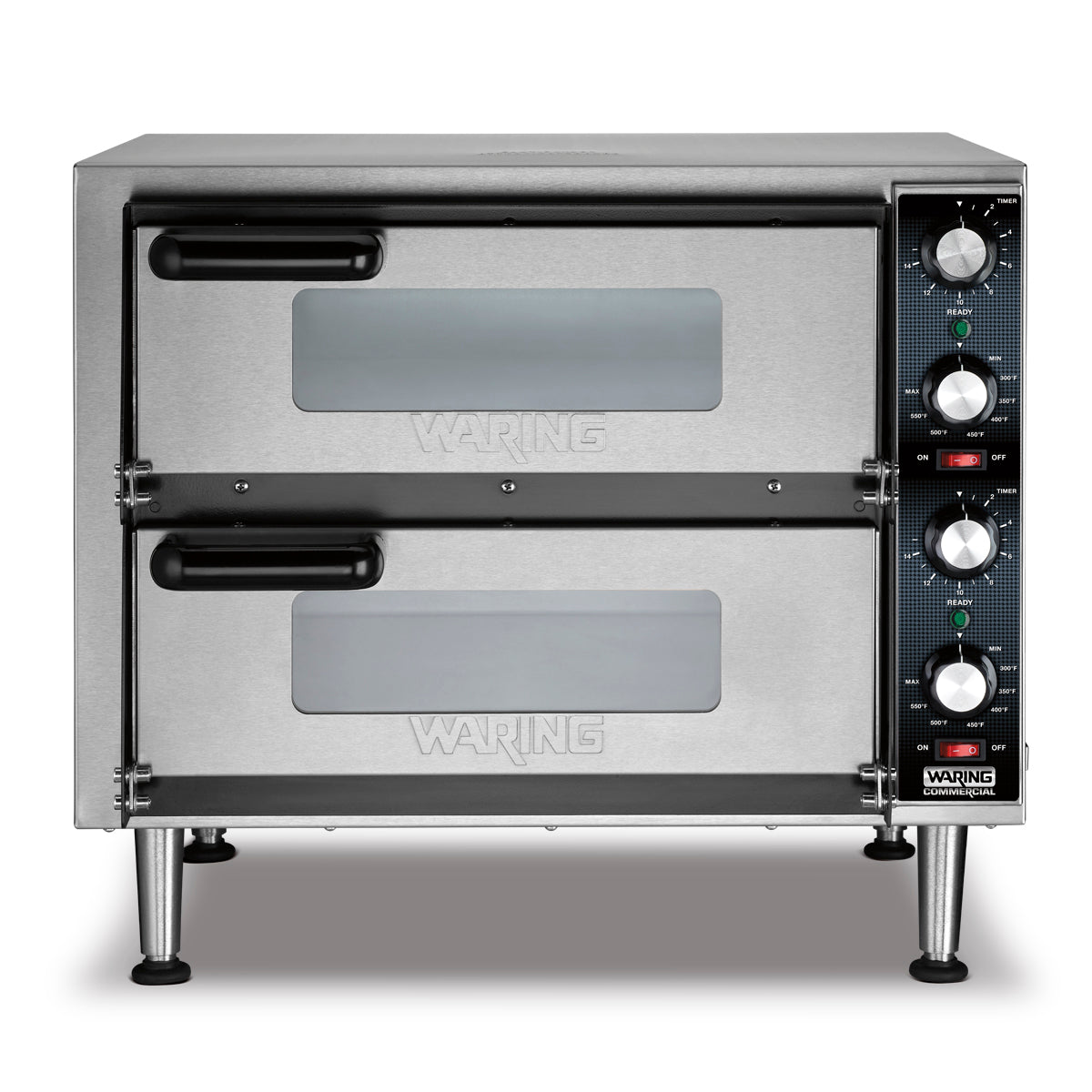 A stainless steel double-deck pizza oven with two stacked compartments, each featuring a horizontal handle and small window. The right side offers control knobs and indicator lights. This countertop pizza oven stands on four sturdy metal legs.