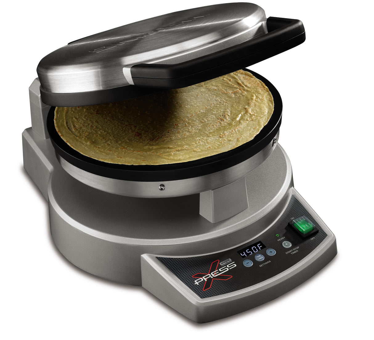 A silver, round tortilla press labeled “Xpress” features a digital display showing 450°F. The upper lid is open, revealing a cooked tortilla inside. This multipurpose cooktop has control buttons, a green switch, and a modern design.