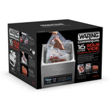 A black and silver box displays the Waring 16-liter Sous Vide Circulating Water Bath. The packaging features photos of vacuum-sealed food bags, the sous vide machine, control panel, and bold white and red product details and branding.