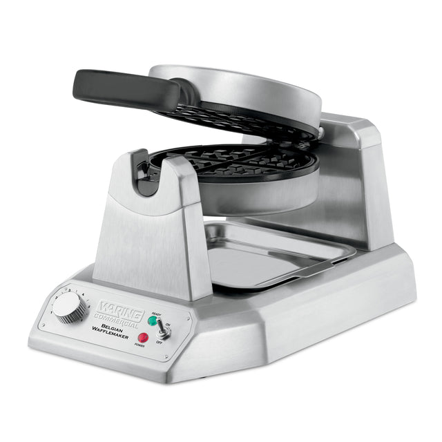 A heavy-duty stainless steel Belgian Waffle Maker with a rotating circular plate, angled base, indicator lights, control knob, and drip tray. The open waffle plates reveal a nonstick grid pattern perfect for international use.