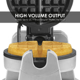 A heavy-duty Belgian Waffle Maker with a golden, thick waffle inside. Text reads: “HIGH VOLUME OUTPUT Makes Up to 25, 1 Thick Belgian Waffles Per Hour.” Features durable stainless steel and non-stick plates for easy release.