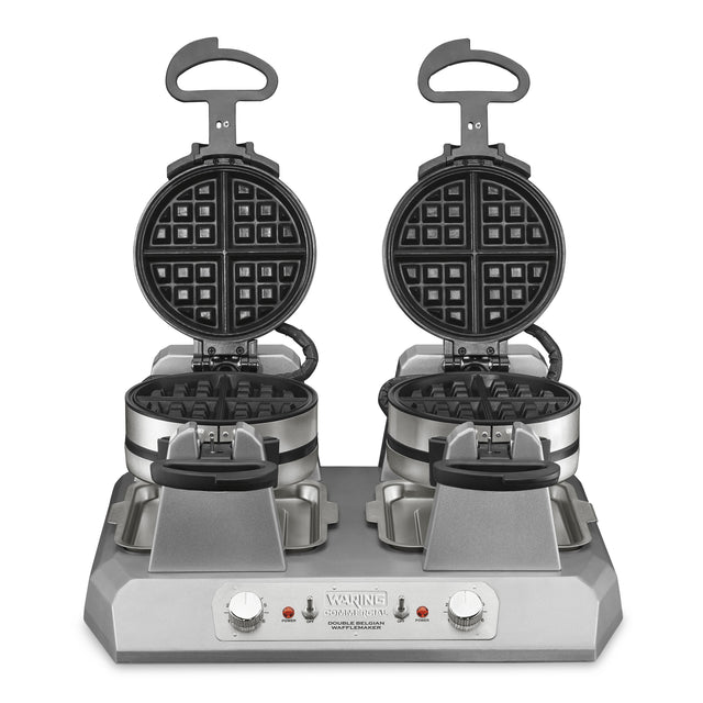 A Commercial Belgian Waffle Maker with independent controls, featuring two non-stick plates open to reveal classic grid patterns. Each side has a handle and rotary knob, plus base indicator lights and branding. The stainless steel unit is clean against a white background.