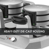 Close-up of a Commercial Belgian Waffle Maker with heavy-duty, brushed metal die-cast housing. Features two black handles, indicator lights, independent controls, and a knob with printed settings. Bold overlay reads, HEAVY-DUTY DIE-CAST HOUSING.