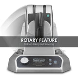 A stainless steel Double Waffle Cone Maker with non-stick plates and a rotary feature for even baking and browning. The front panel displays a control knob, indicator lights, and Waring Commercial Double Waffle Cone Maker text.