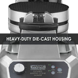 Close-up of a silver commercial double Waffle Cone Maker with black handle and non-stick plates. The machine features a control panel with dials and indicator lights. Bold text across the center reads “HEAVY-DUTY DIE-CAST HOUSING.”.